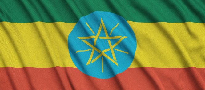 ethiopia flag is depicted on a sports cloth fabric with many folds sport team waving banner
